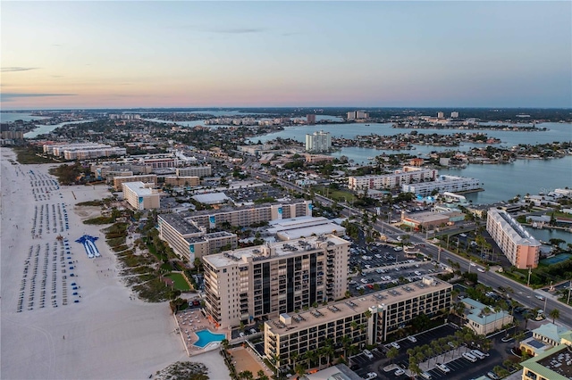 aerial view at dusk with a water view