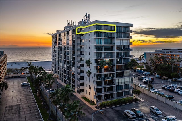 outdoor building at dusk featuring a water view