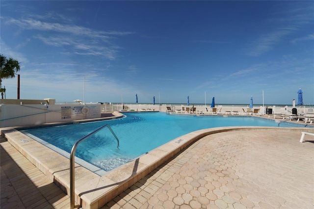 view of swimming pool with a patio