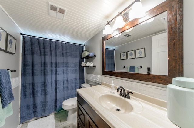 bathroom with vanity, tile patterned floors, toilet, visible vents, and a shower with shower curtain