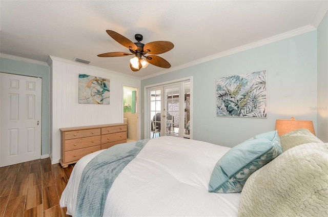bedroom with dark wood-style flooring, access to outside, visible vents, ornamental molding, and french doors
