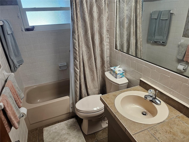 full bathroom featuring toilet, shower / tub combo, tile walls, vanity, and decorative backsplash