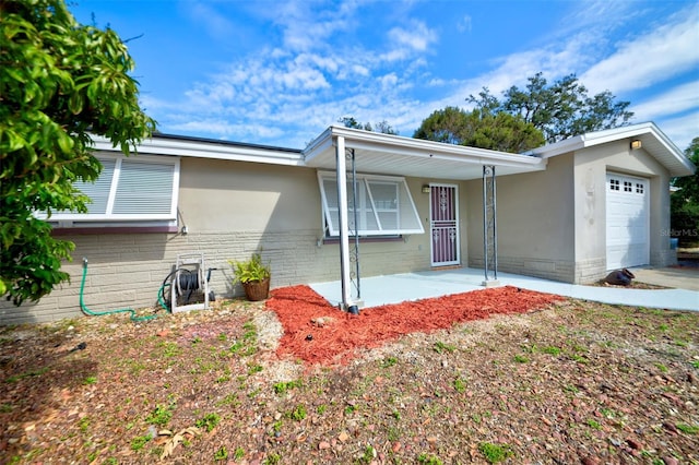 ranch-style house featuring a garage