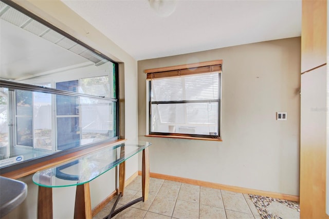 interior space with plenty of natural light and light tile patterned floors