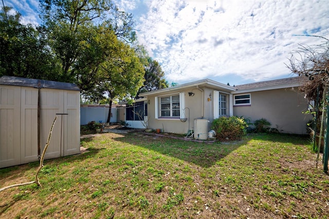 exterior space with a front lawn and a shed