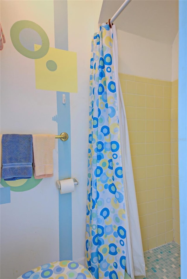 bathroom with a shower with curtain