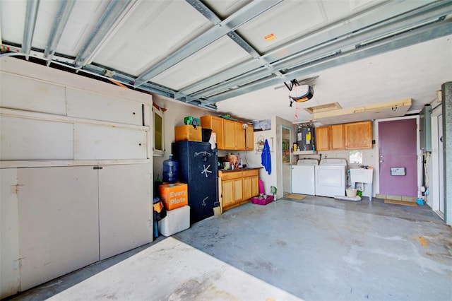 garage featuring sink and washer and clothes dryer