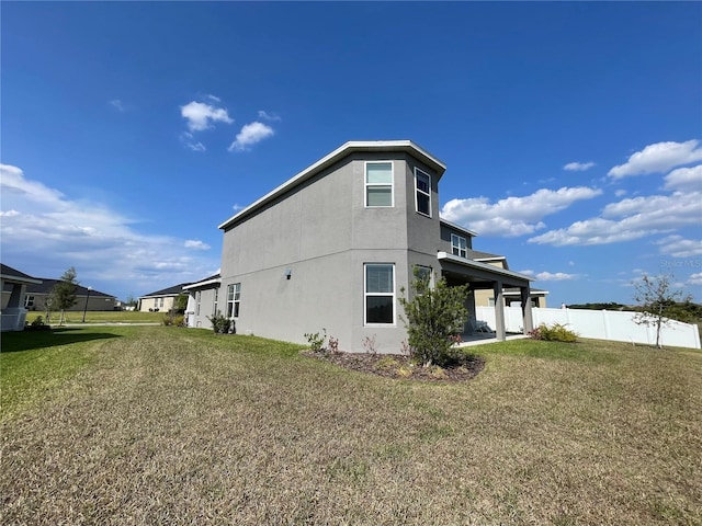 view of property exterior with a yard