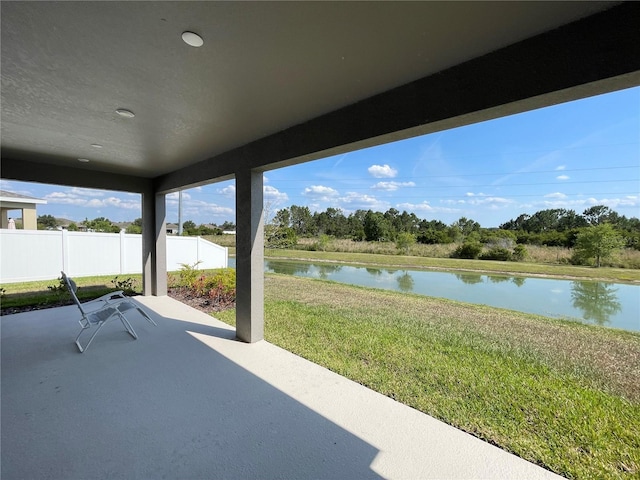 view of patio / terrace with a water view