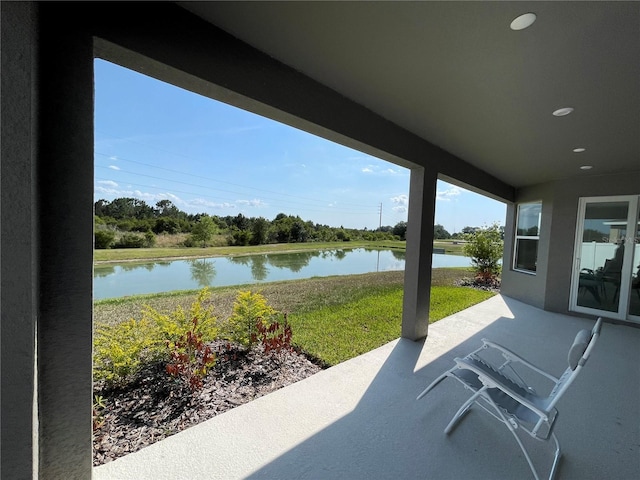 view of patio / terrace with a water view