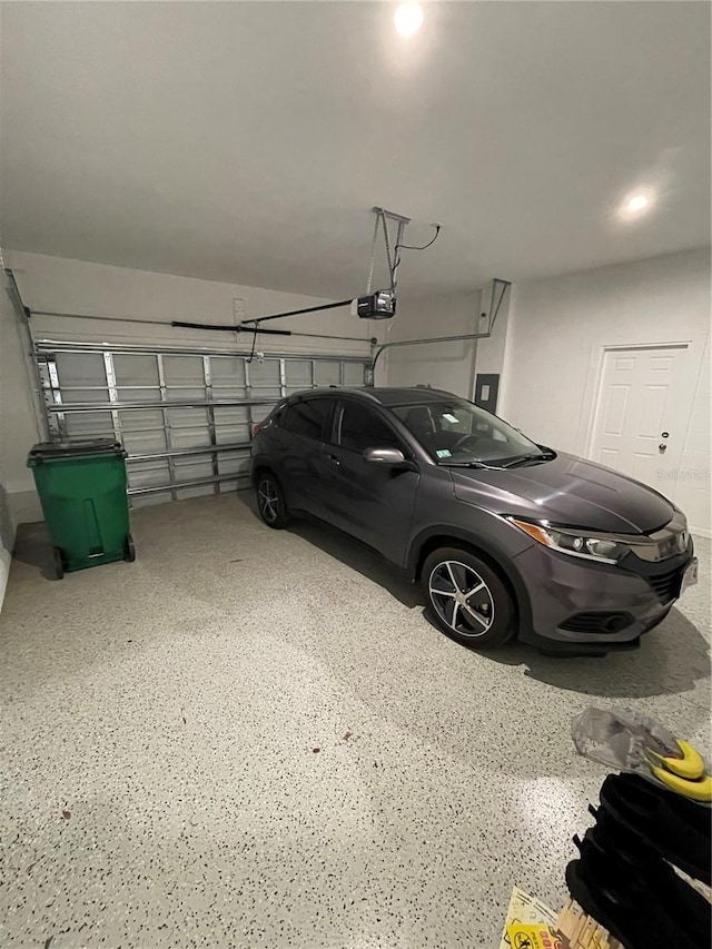 garage featuring a garage door opener