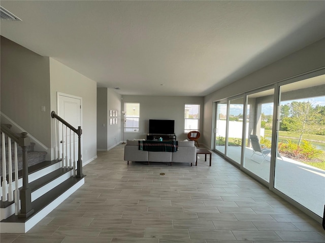 unfurnished living room featuring a wealth of natural light