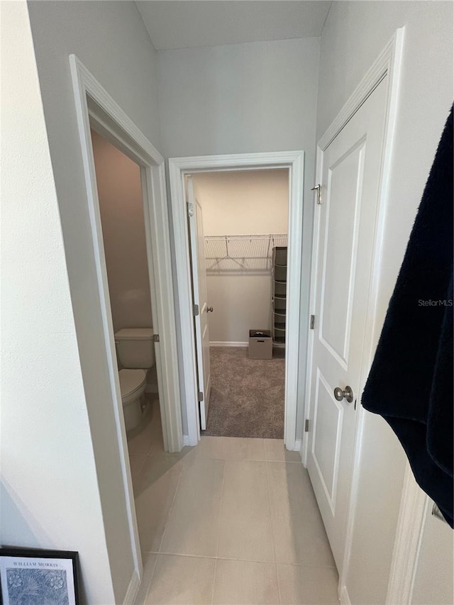 corridor featuring light tile patterned floors