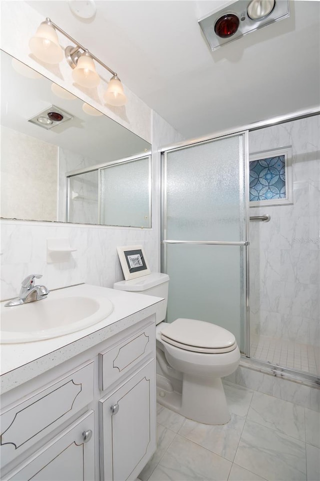 bathroom with vanity, an enclosed shower, tasteful backsplash, and toilet