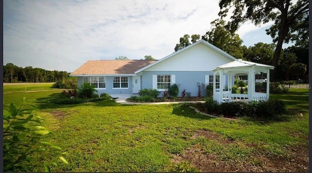 back of house featuring a yard