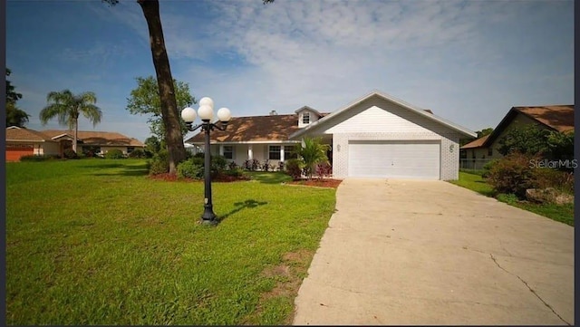 ranch-style home featuring a garage and a front yard