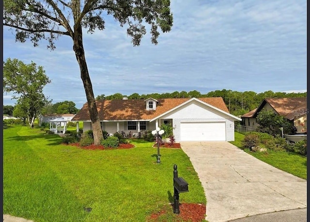 ranch-style house with a garage and a front lawn