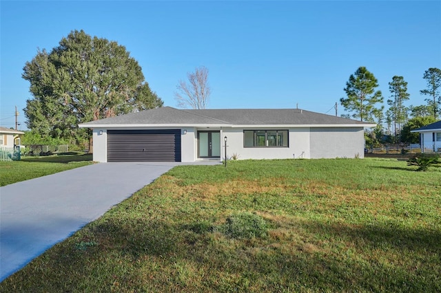 ranch-style house featuring concrete driveway, an attached garage, a front lawn, and stucco siding