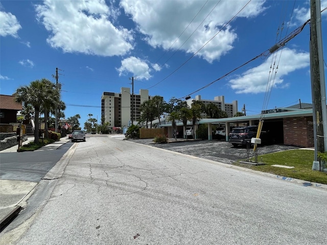 50 154th Ave Unit 50, Madeira Beach, FL 33708 - view of asphalt street featuring curbs and sidewalks