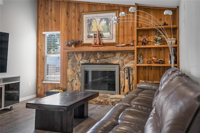 living room with a fireplace and dark hardwood / wood-style flooring