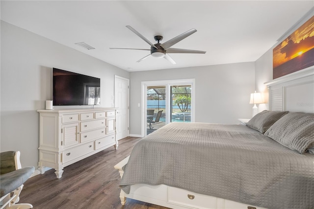 bedroom featuring dark wood-type flooring, access to outside, and ceiling fan