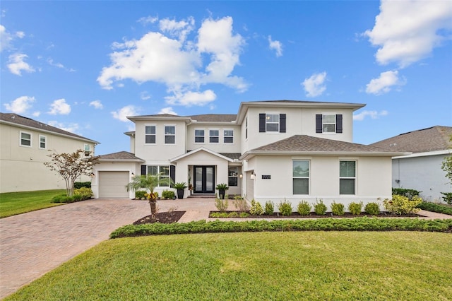 view of front of home with a garage and a front yard