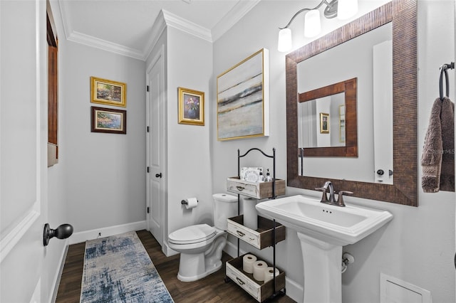 bathroom featuring crown molding, wood-type flooring, and toilet