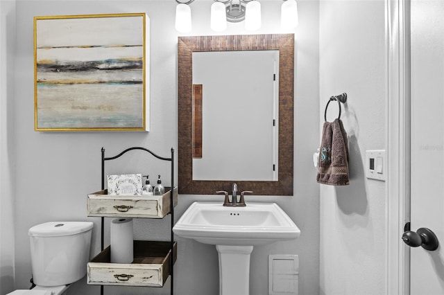 bathroom with sink and toilet