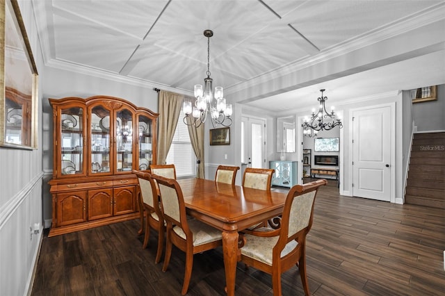 dining space featuring crown molding, dark hardwood / wood-style flooring, and a chandelier