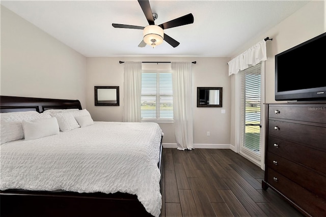 bedroom with ceiling fan and dark hardwood / wood-style flooring