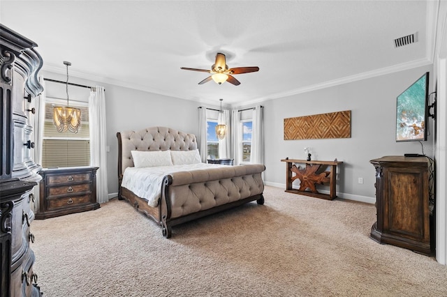 bedroom with ornamental molding, ceiling fan with notable chandelier, and light colored carpet