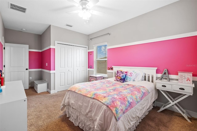 carpeted bedroom featuring a closet and ceiling fan