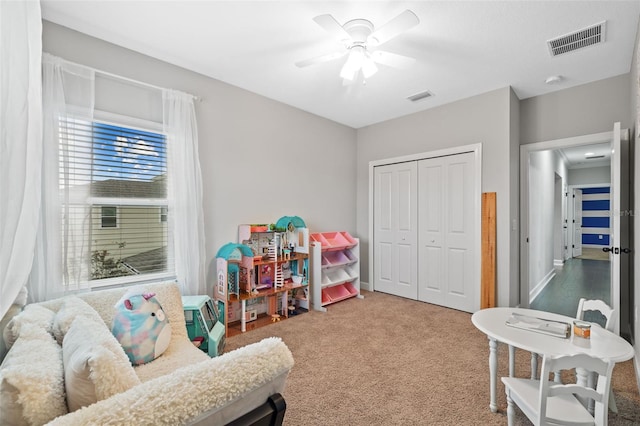 recreation room with ceiling fan and carpet floors