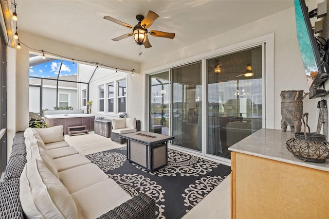 sunroom / solarium featuring ceiling fan