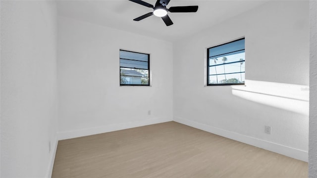 unfurnished room with ceiling fan and light hardwood / wood-style floors