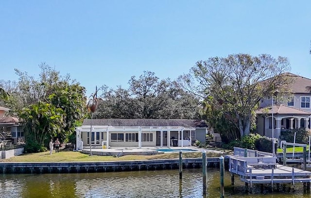 back of house featuring a water view