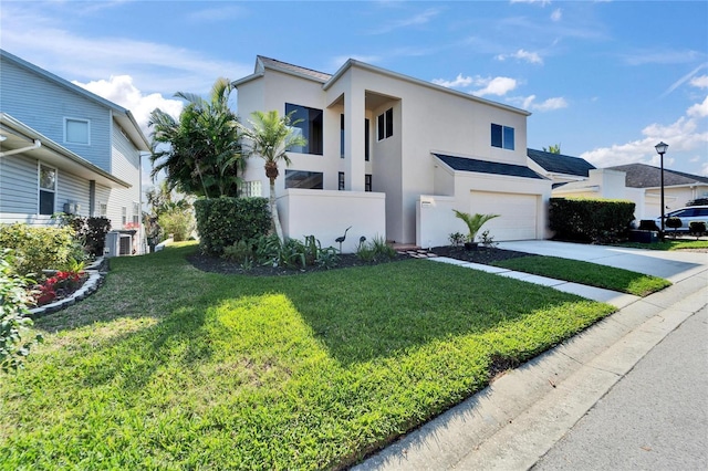 view of front of house featuring a garage and a front lawn