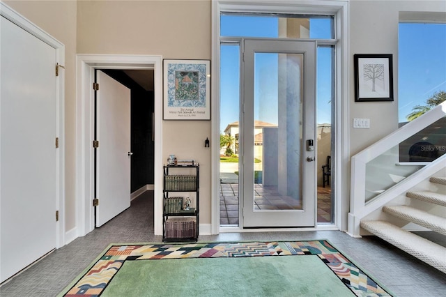 view of carpeted foyer