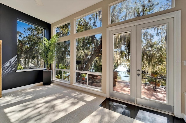 unfurnished sunroom featuring french doors