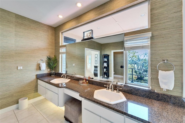 bathroom with tile patterned floors and vanity