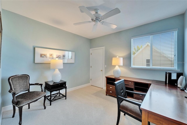 carpeted home office with ceiling fan