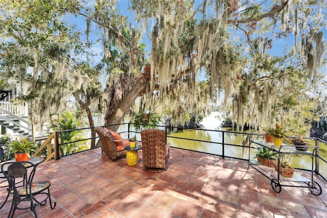 view of patio / terrace with a water view