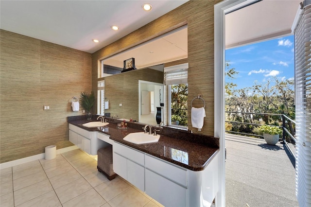 bathroom with tile patterned flooring and vanity