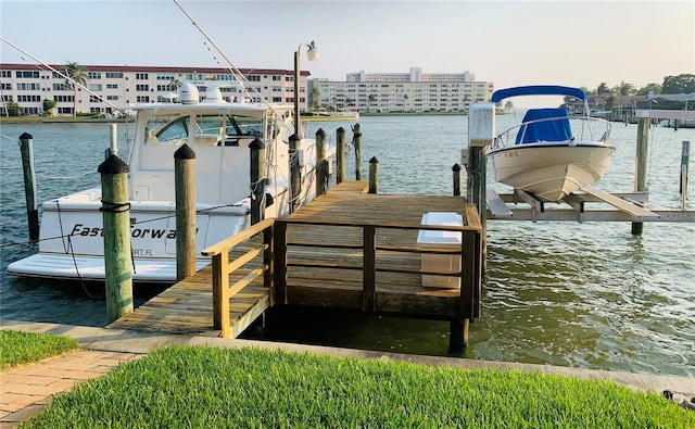 view of dock featuring a water view and boat lift