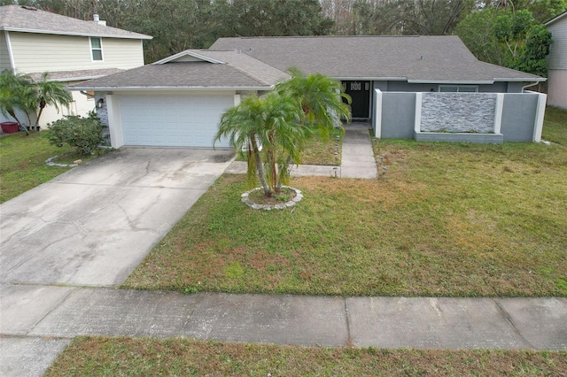 view of front of house featuring a garage and a front lawn