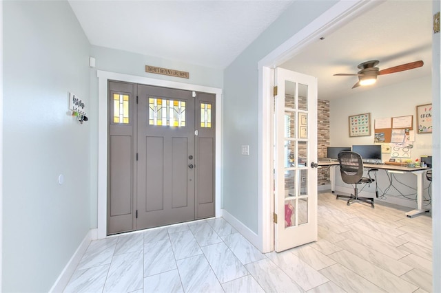 entryway with ceiling fan and french doors