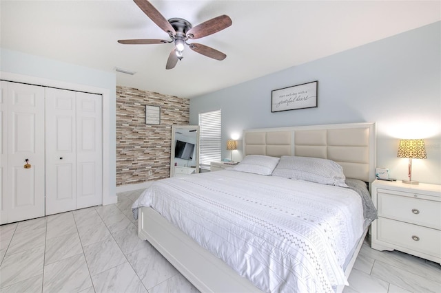 bedroom featuring ceiling fan and a closet