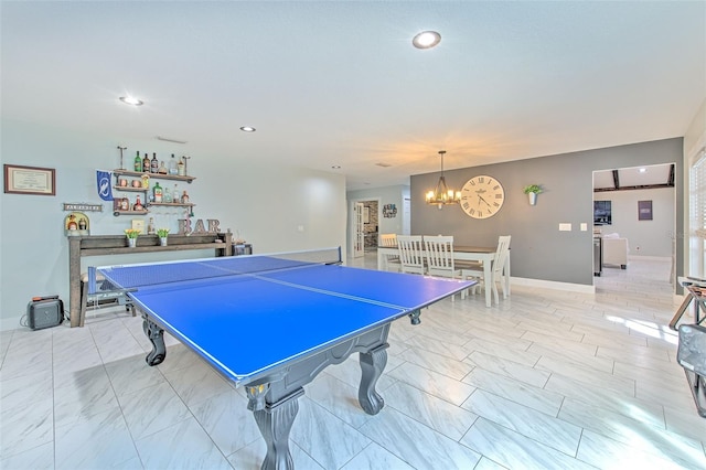 recreation room featuring a notable chandelier