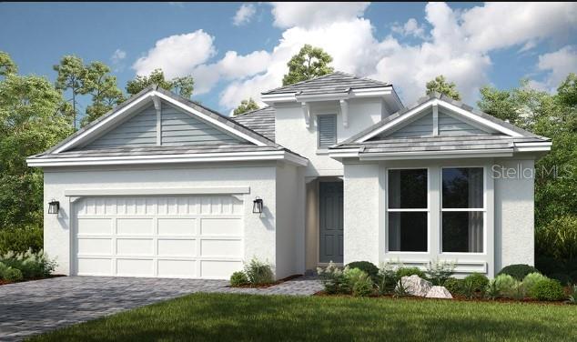 front of property featuring a garage and a front yard