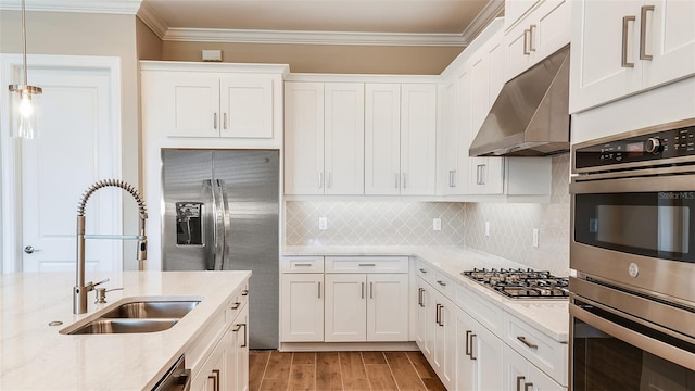 kitchen featuring appliances with stainless steel finishes, sink, and white cabinets